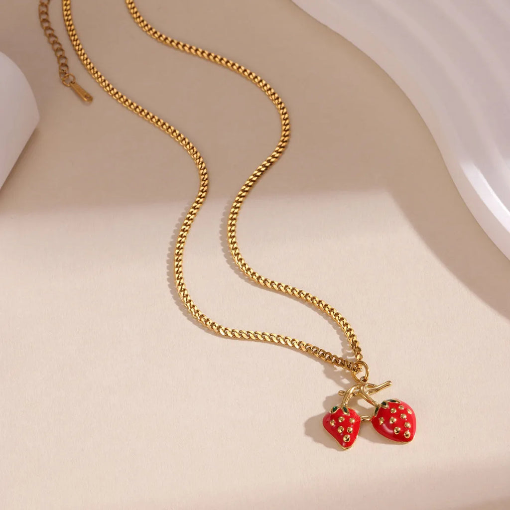 Stainless steel necklace with a strawberry fruit pendant in red or white gradient finish