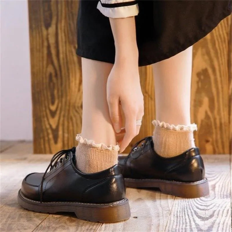 Women's black preppy retro Mary Jane shoes with round toe and front lace-up.