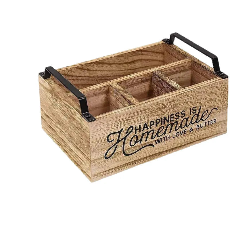 Wooden kitchen storage box with internal grid dividers for organising utensils.
