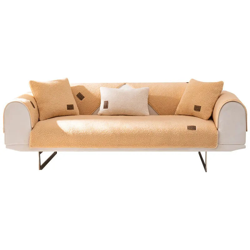 Lambswool sofa slipcover in solid blue colour laid flat, showing its texture and simple design.