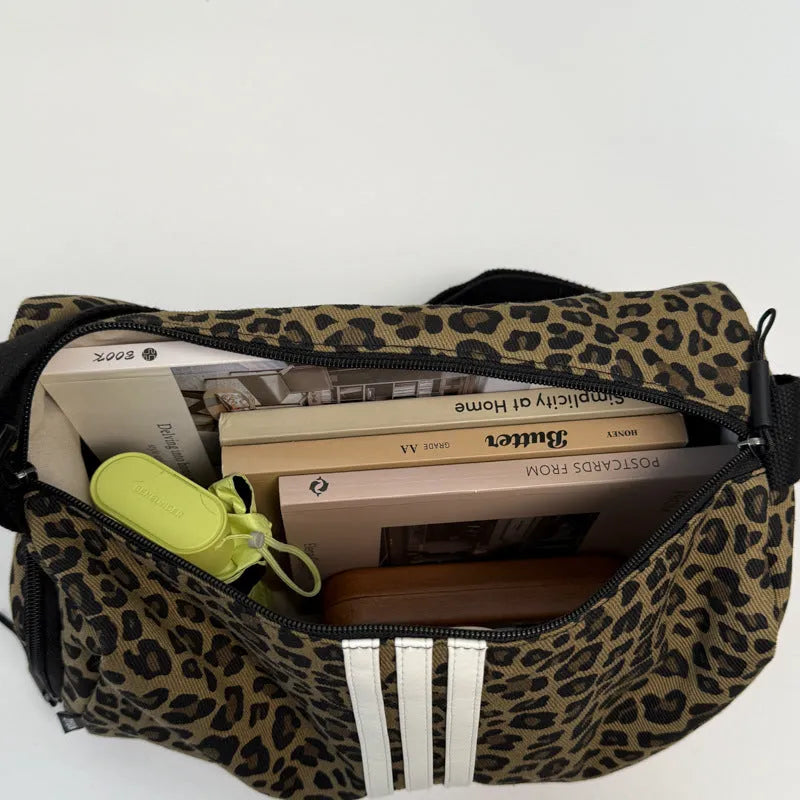 Leopard print sports style shoulder messenger bag with crossbody strap and striped lining