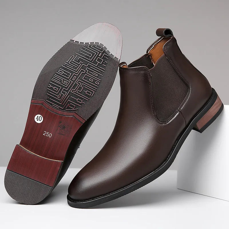 Men's black pointed toe Chelsea boots with mid-calf height and decorative stitching
