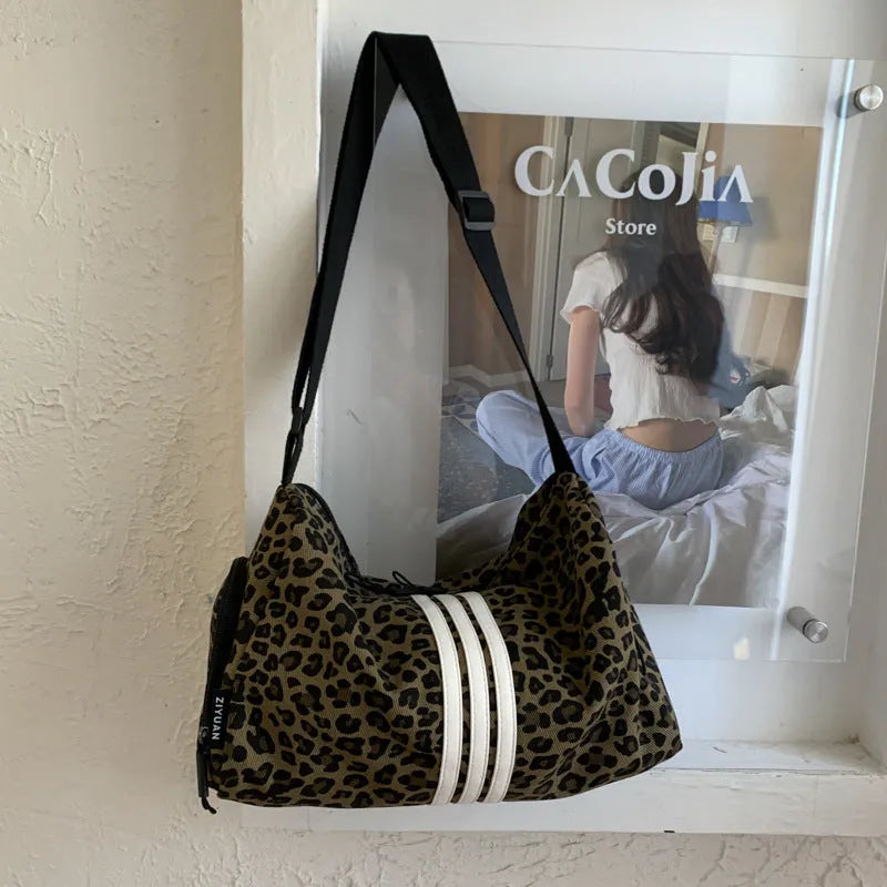 Leopard print cloth cross-body messenger bag with stitching detail and large capacity