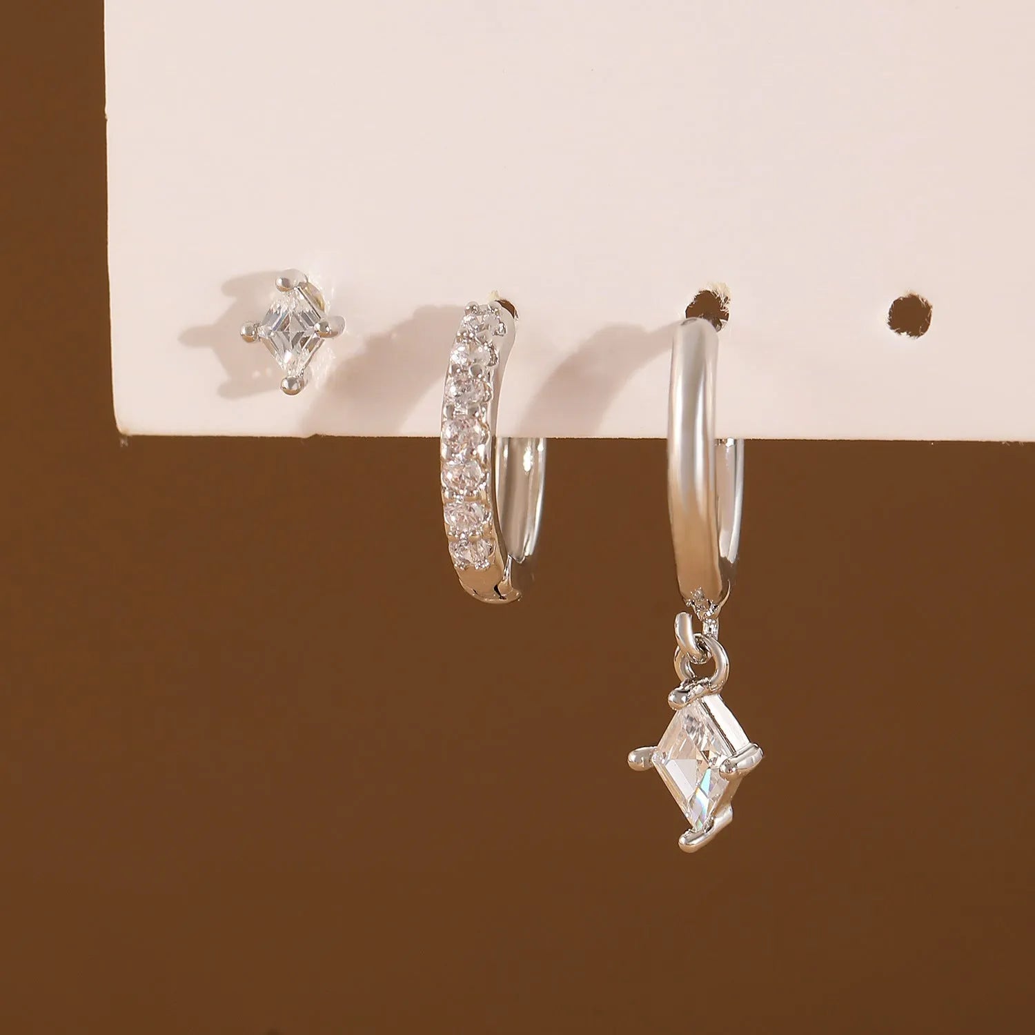 Geometric ladies earring set with zircon detailing in gold and white colours