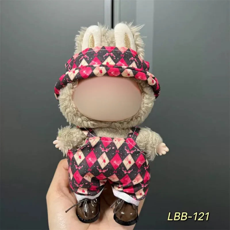 Plastic clothing outfit for a 17cm tall vinyl figure or doll on a display stand.