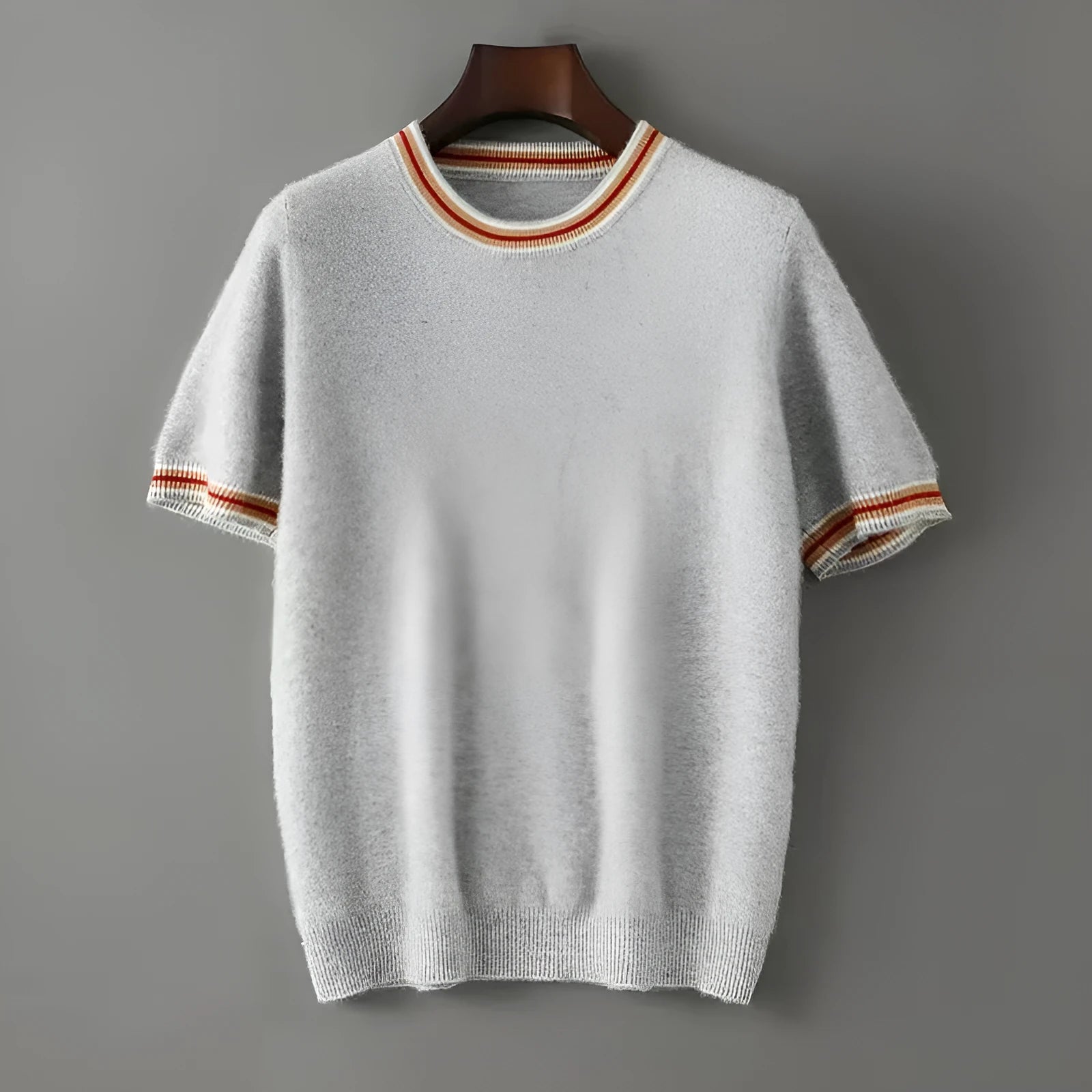Men's grey pure wool short sleeve round neck sweater laid flat.