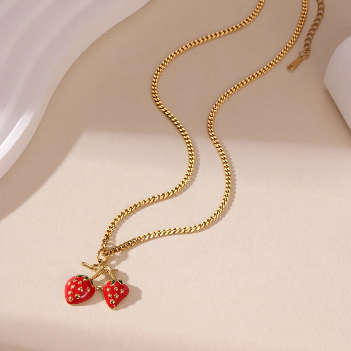 Stainless steel necklace with a strawberry fruit pendant in red or white gradient finish