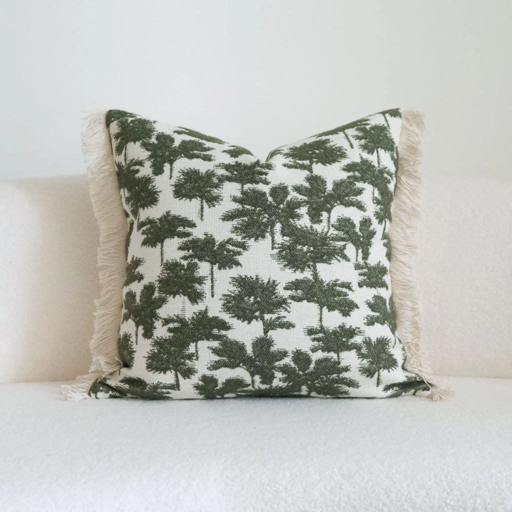 Green cotton and linen hotel sample room pillow with decorative tassel beading in stripe and plant patterns