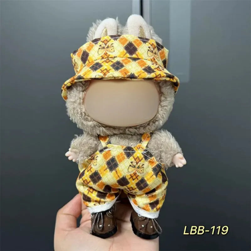 Plastic clothing outfit for a 17cm tall vinyl figure or doll on a display stand.