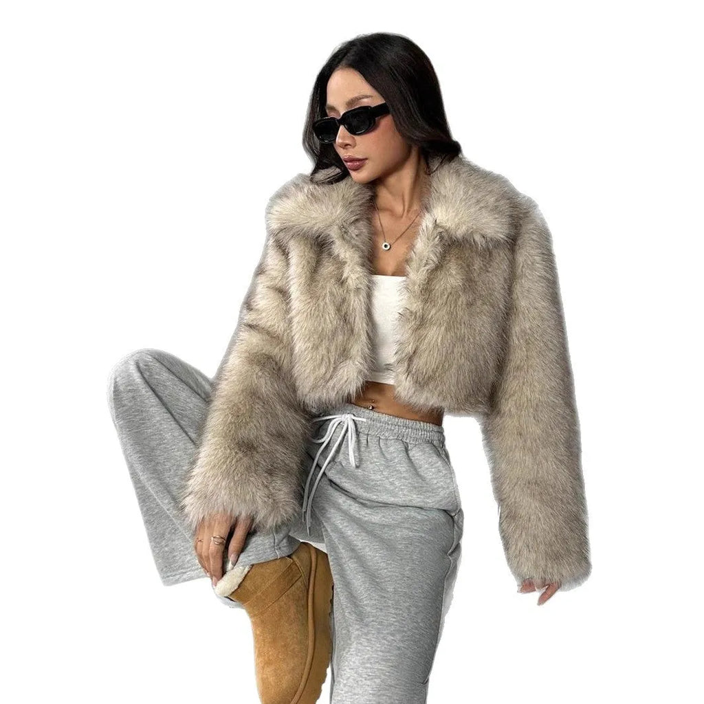 Artificial fox fur fashion coat with a fur collar and long sleeves in a short length.