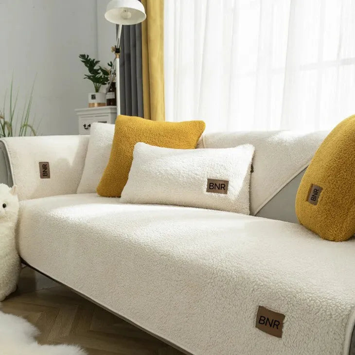 Lambswool sofa slipcover in solid blue colour laid flat, showing its texture and simple design.