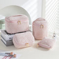 Flannelette makeup bag four-piece set in blue with dots pattern, showing cube-style polyester bags