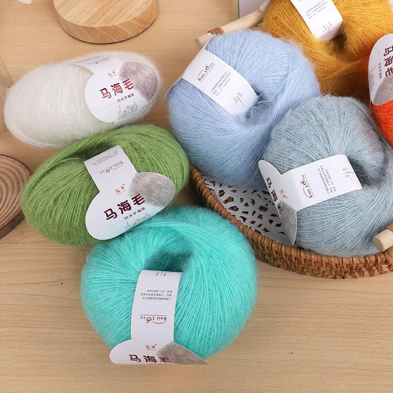 A ball of mohair wool for DIY hand-weaving a scarf in the Inverness thread style, with 34 colour options.