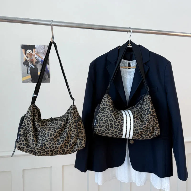 Leopard print sports style shoulder messenger bag with crossbody strap and striped lining