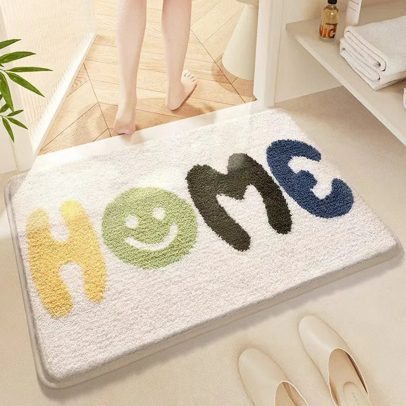 Sky and Sea rainbow print floor mat with anti-slip plastic backing on a wooden floor.