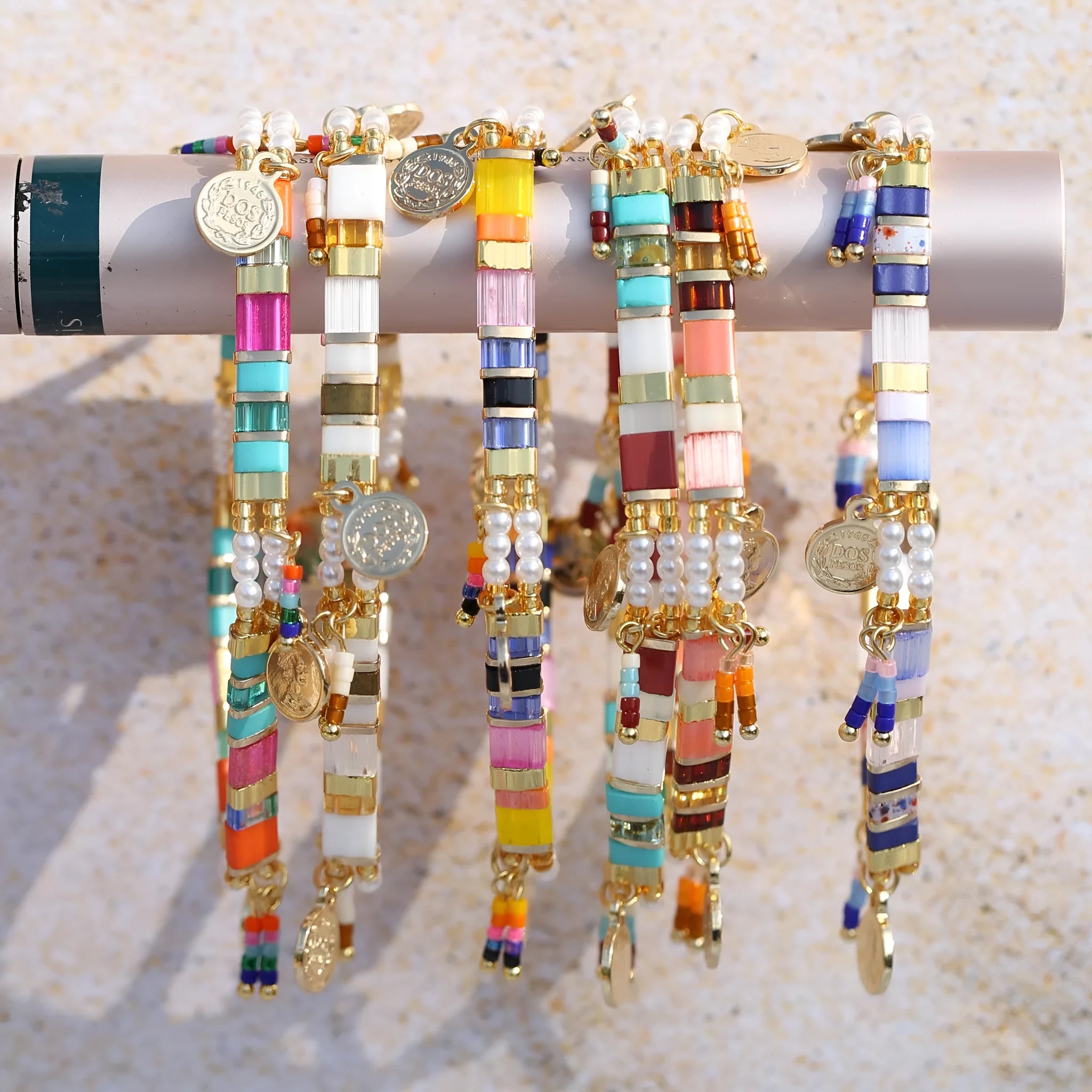 Women's handmade bracelet with glass coloured imitation pearl beads on wrist, showing one of six available colour styles.