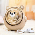 Cute dog-shaped desktop USB fan in a choice of colours on a wooden desk.