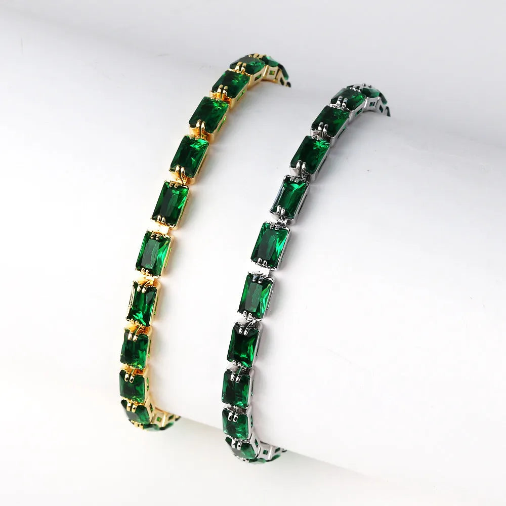 Women's fashion zircon bracelet in alloy with gold electroplated finish and coloured stone settings.