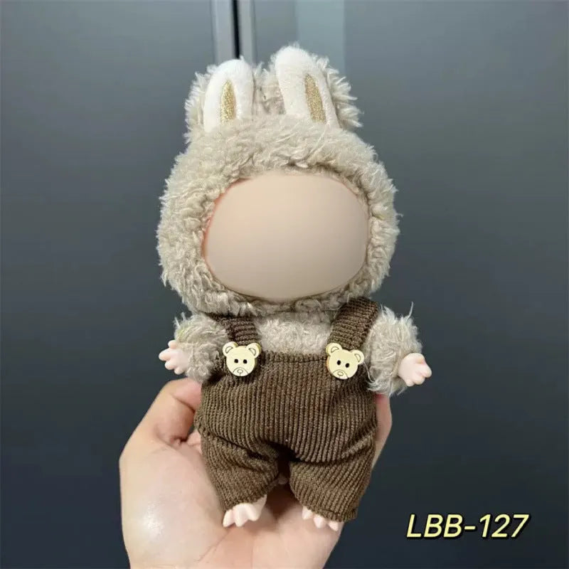 Plastic clothing outfit for a 17cm tall vinyl figure or doll on a display stand.