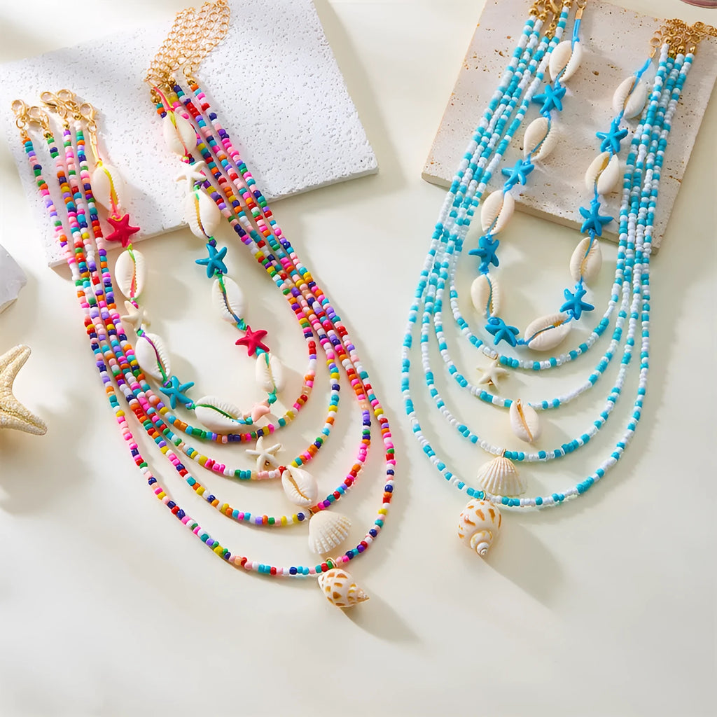 Five-piece women's necklace set with starfish shell and conch bead designs on adjustable chain