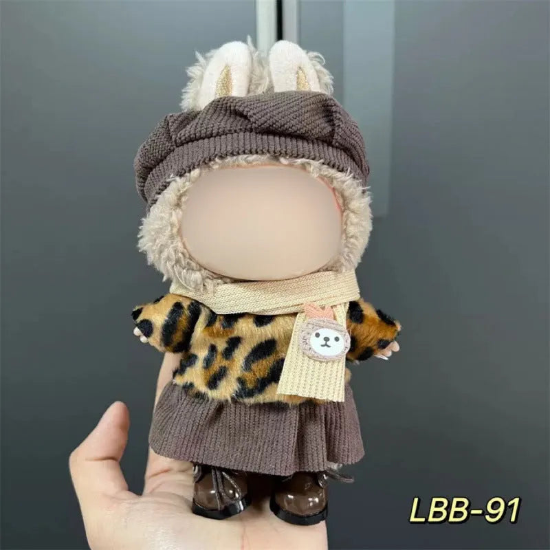 Plastic clothing outfit for a 17cm tall vinyl figure or doll on a display stand.