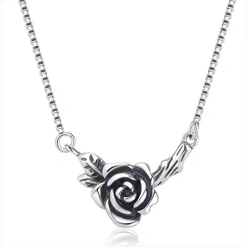 Retro black rose necklace with vintage distressed copper pendant on cross chain