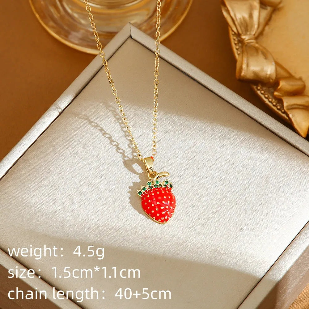Titanium steel indie necklace with O-ring chain and a choice of cherry, strawberry, or pepper pendant in golden or steel finishes.
