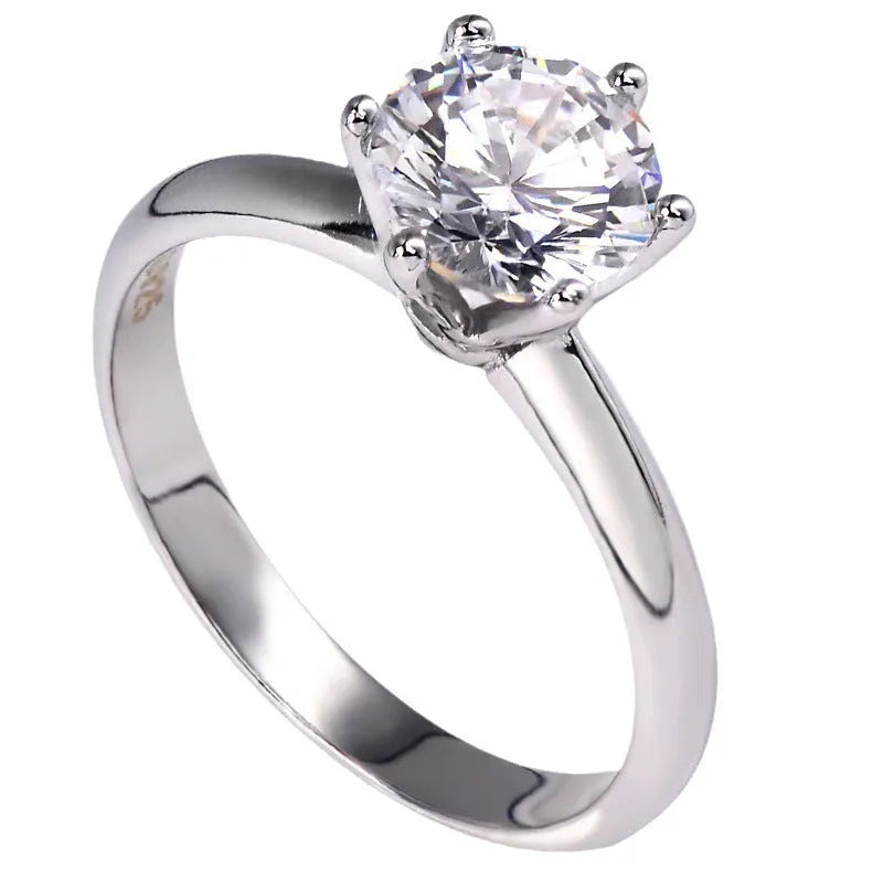 Women's six-claw inlaid zircon ring in white gold plated finish on geometric band