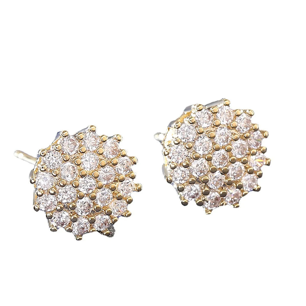 Pair of copper electroplated stud earrings in silver with irregular and round shapes on white background