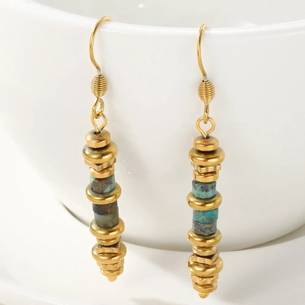 Titanium steel geometric dangle earrings in a retro style with an 18K plated finish.