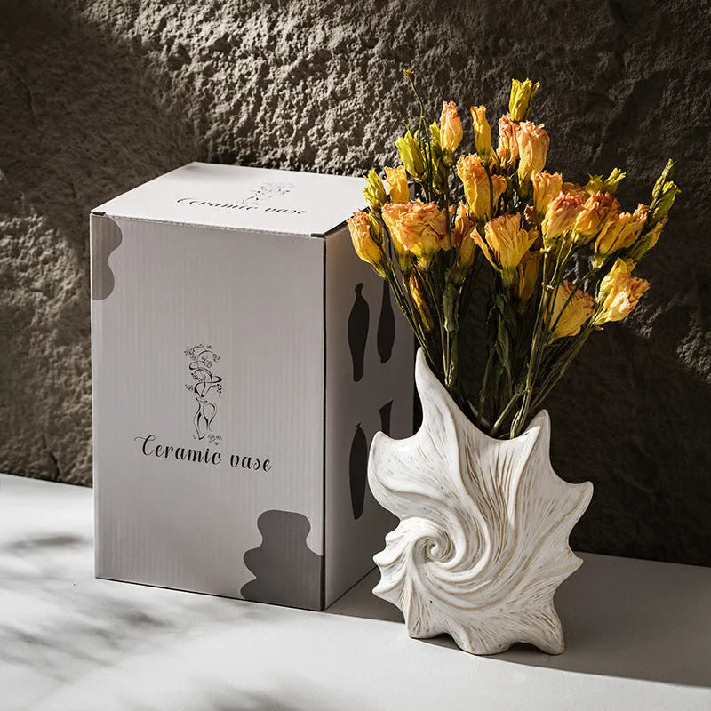 European style ceramic vase with coloured glaze finish and hexagonal base design