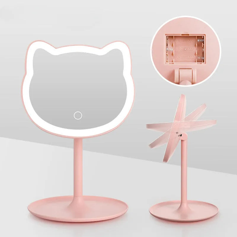 Pink rechargeable makeup mirror with fill light on a desk, ABS frame, aluminium mirror, size 14cm x 18cm