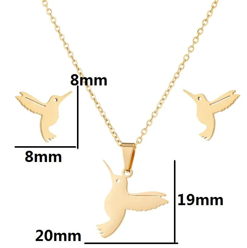 Cute little animal stainless steel jewellery set with bird motif necklace and earrings in gold colour on a white background