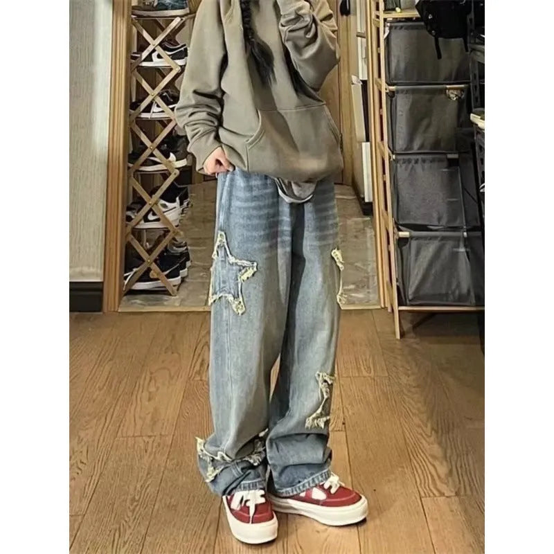 Women's wash blue high-waist straight-leg denim jeans on a hanger.
