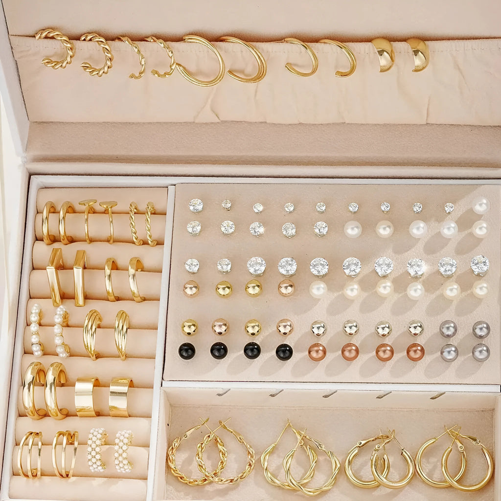 108 geometric earrings in gold and yellow electroplated finishes with round decorative elements