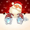 Women's silver-toned heart-shaped earrings with a Santa Claus decoration.