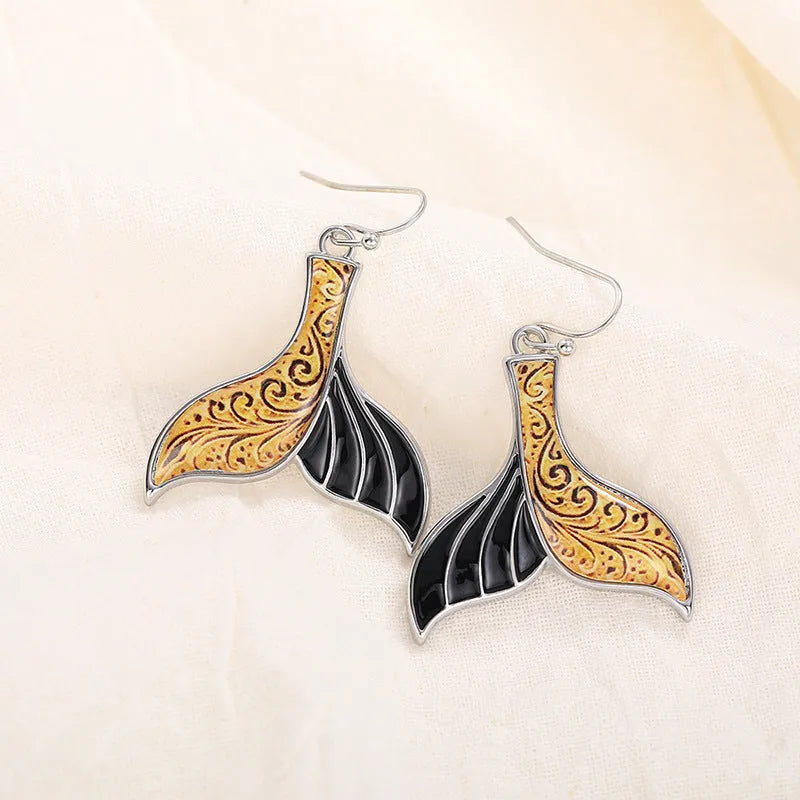Women's retro whale design fishtail earrings in white gold alloy with distinctive animal-inspired jewellery styling