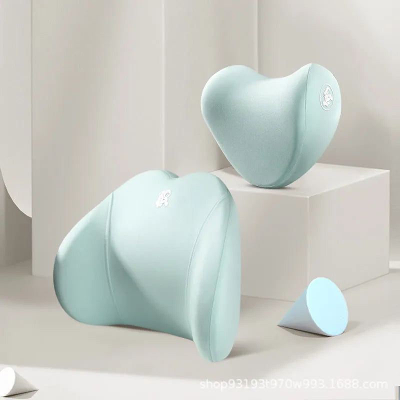 Heart-shaped car pillow in choice of colours, shown as headrest and lumbar support on a car seat.