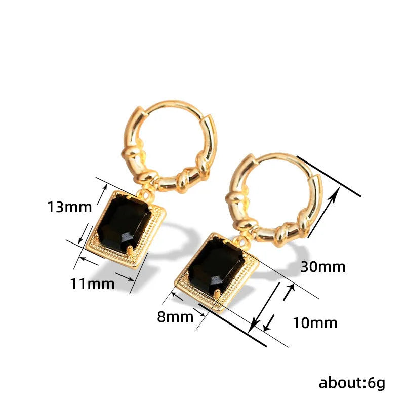 A pair of black geometric quadrilateral copper earrings with a retro French court design.
