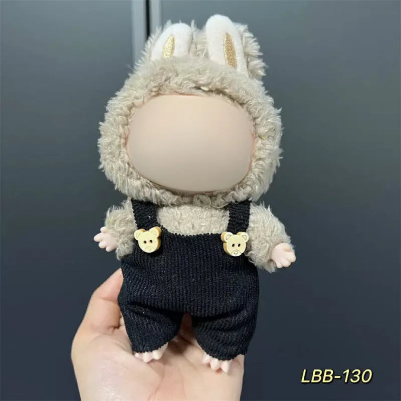 Plastic clothing outfit for a 17cm tall vinyl figure or doll on a display stand.