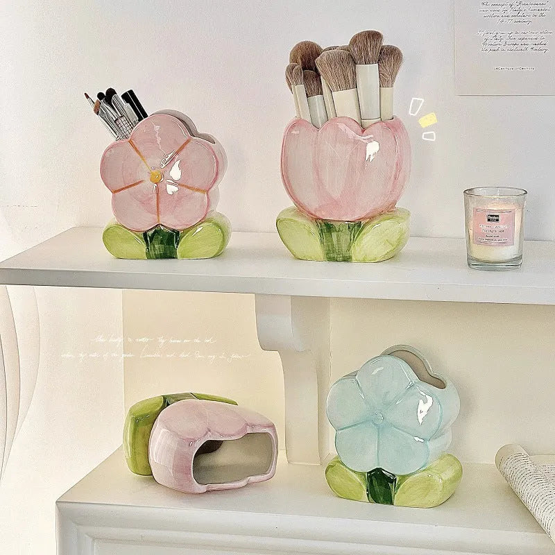 Ceramic pen holder storage box with floral pattern decoration on desktop