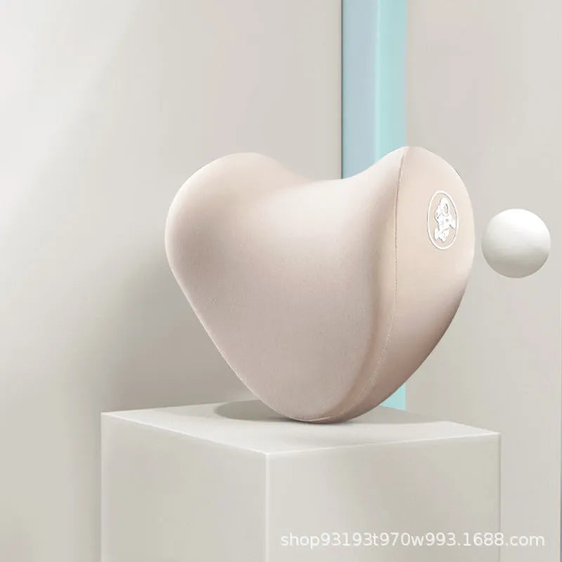 Heart-shaped car pillow in choice of colours, shown as headrest and lumbar support on a car seat.