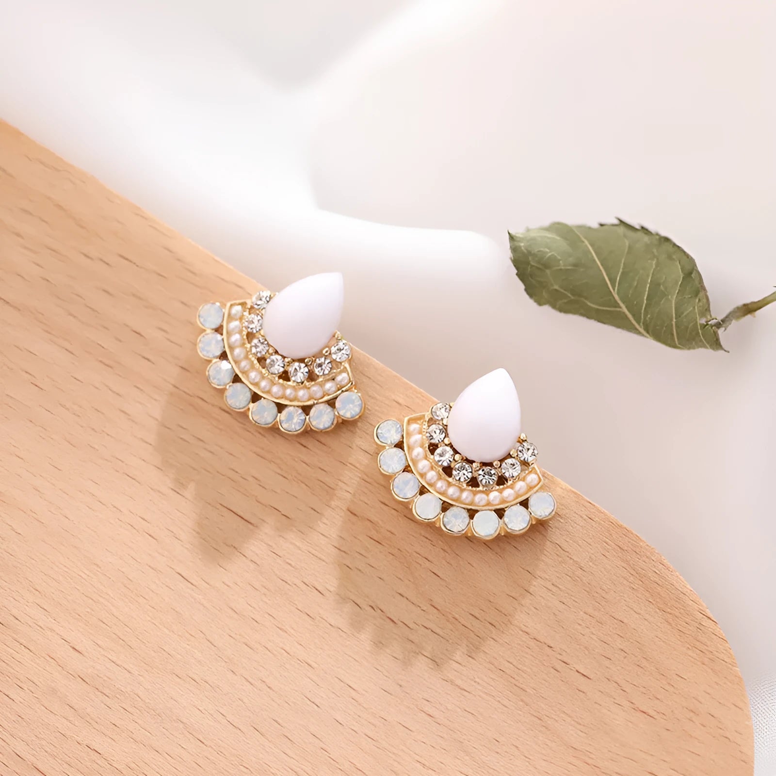 Women's retro silver-tone fan-shaped geometric drop earrings with rhinestone details on a stud post.