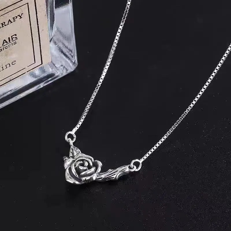 Retro black rose necklace with vintage distressed copper pendant on cross chain