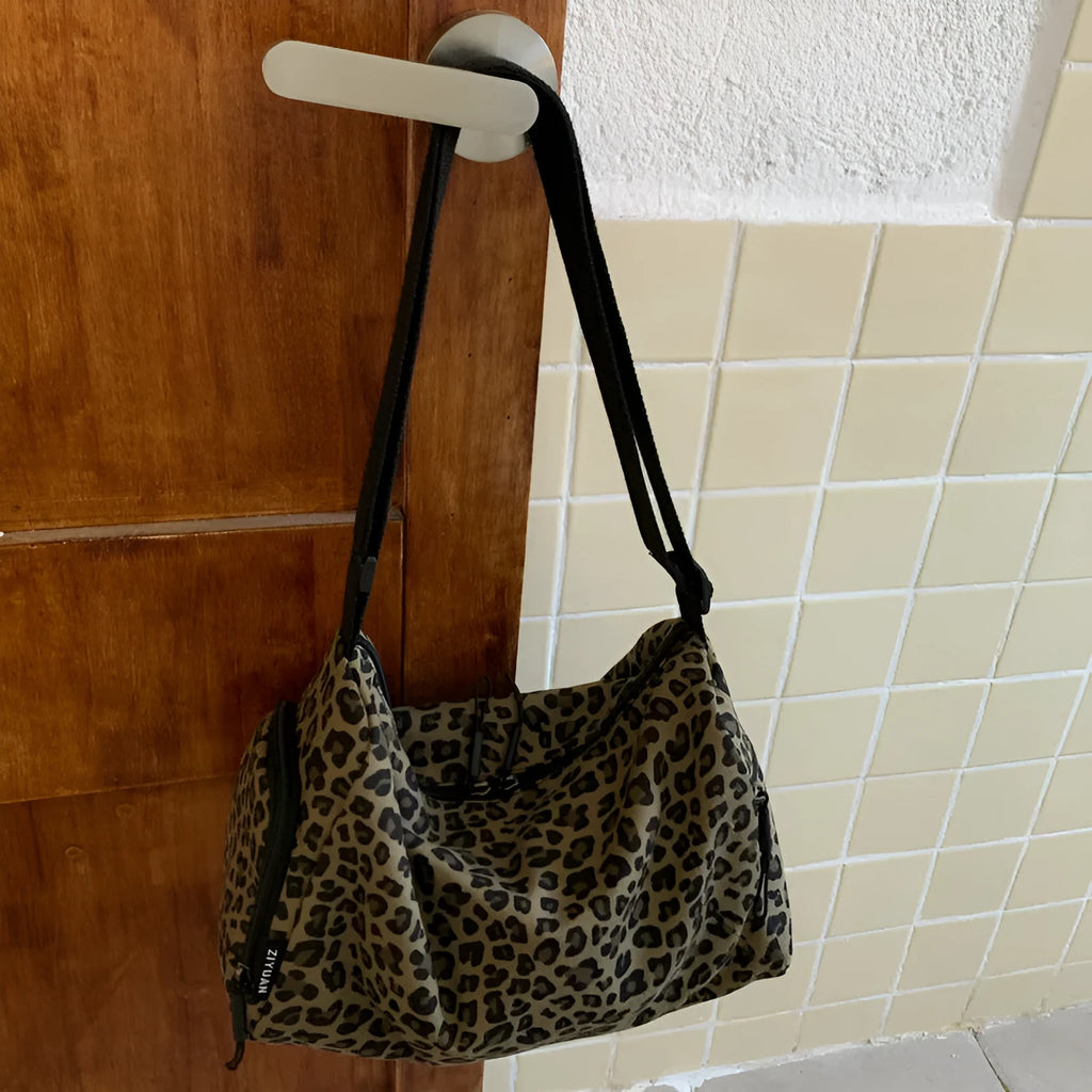 Leopard print sports style shoulder messenger bag with crossbody strap and striped lining