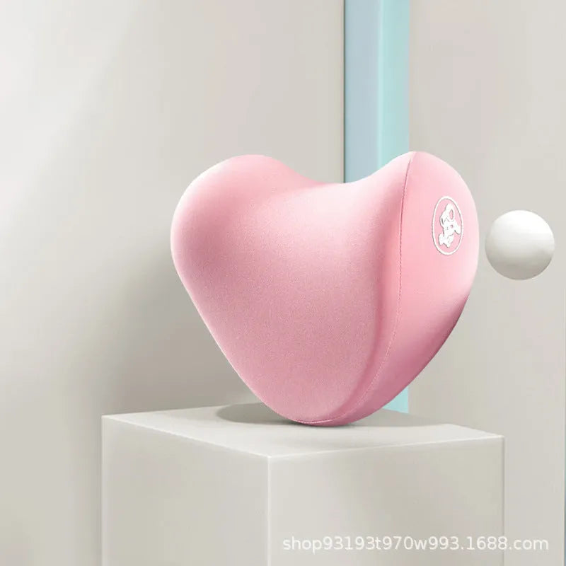 Heart-shaped car pillow in choice of colours, shown as headrest and lumbar support on a car seat.