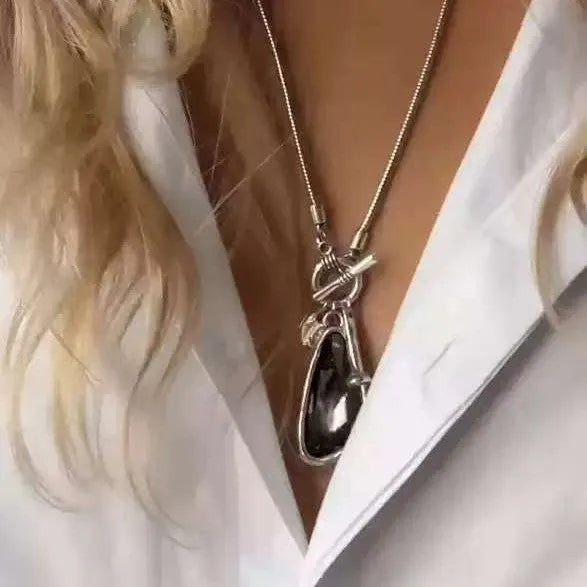 Women's long geometric alloy pendant necklace with snake bone chain, showing blue water drop colour option.