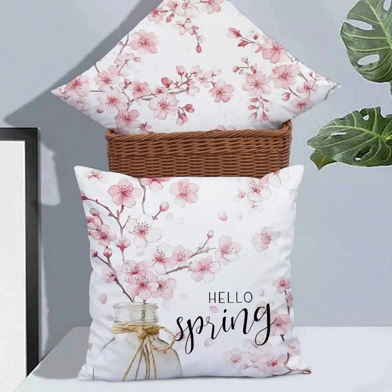 Short velvet cushion cover with cherry blossom letter design, 45cm square, shown in one of four colour options.