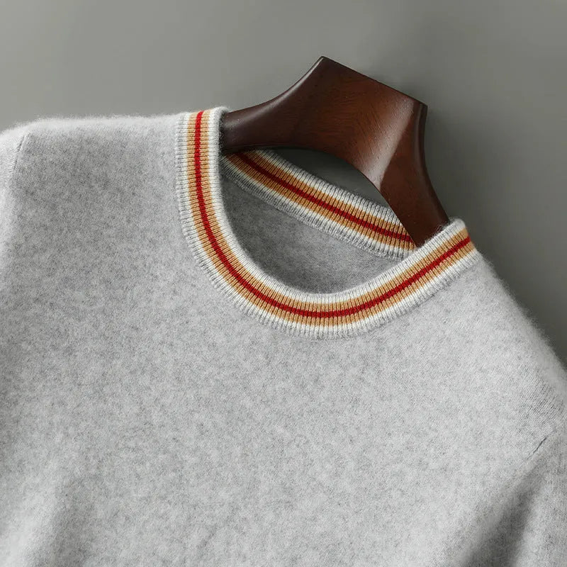 Men's grey pure wool short sleeve round neck sweater laid flat.