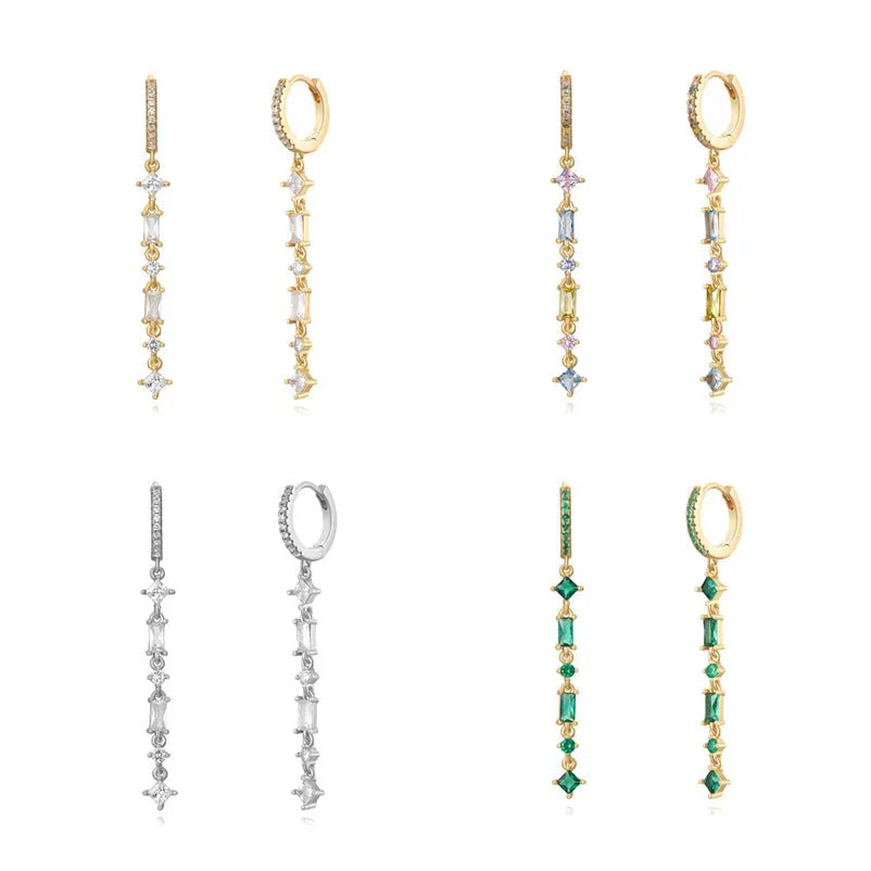 Geometric U-shaped ear clip with colourful stone inlays and metallic framework on earlobe